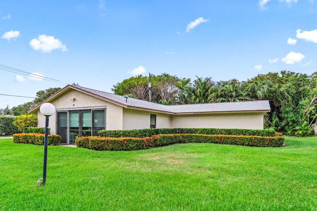 ranch-style home featuring a front yard