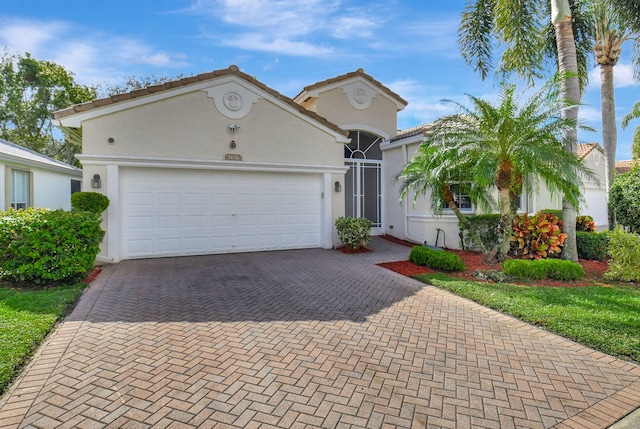 view of front of home with a garage