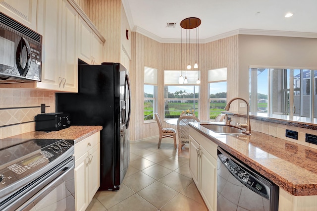 kitchen featuring pendant lighting, black appliances, sink, ornamental molding, and tasteful backsplash