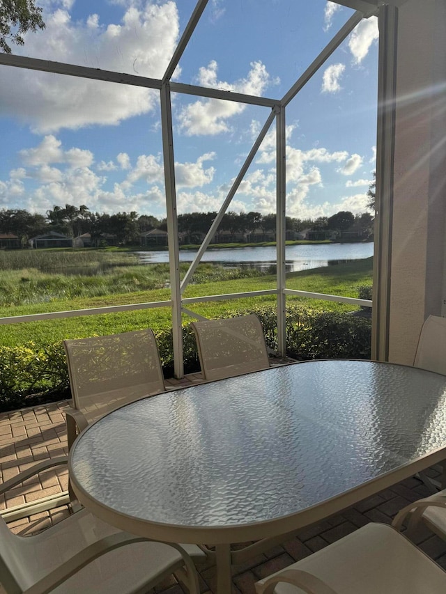 sunroom with a water view