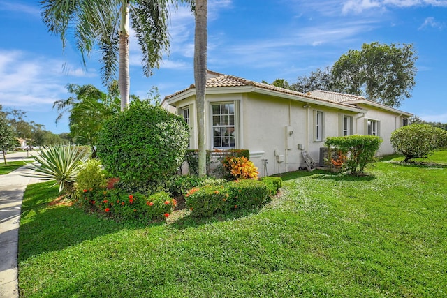 view of home's exterior featuring a lawn