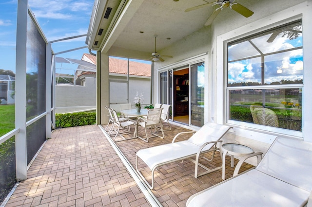 sunroom / solarium with ceiling fan