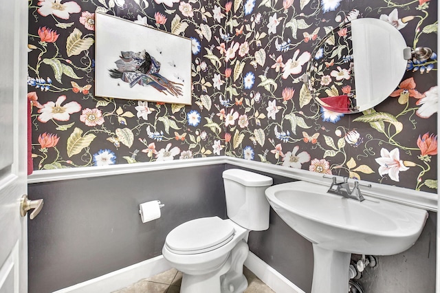 bathroom featuring tile patterned flooring and toilet