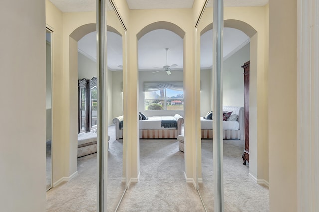 hallway featuring light carpet