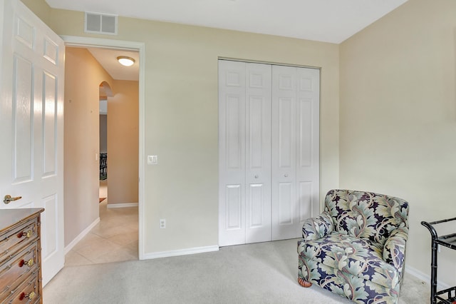 living area featuring light colored carpet