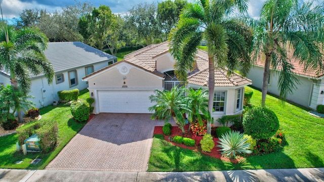 view of front of property with a front lawn and a garage