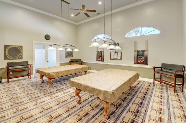 recreation room featuring a towering ceiling, ceiling fan, crown molding, and pool table