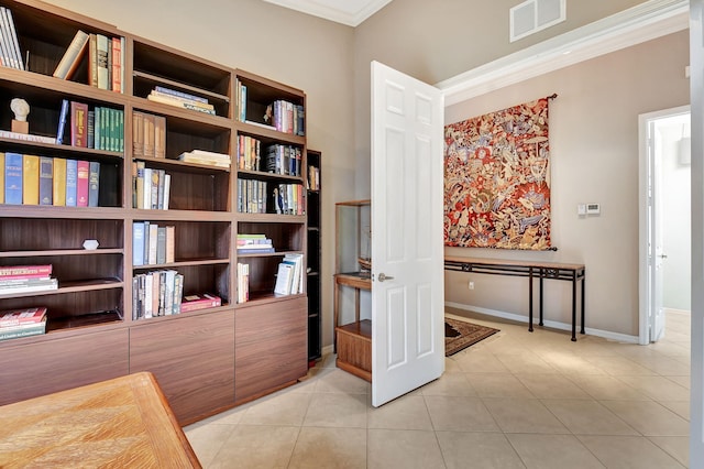 interior space featuring light tile patterned floors and ornamental molding