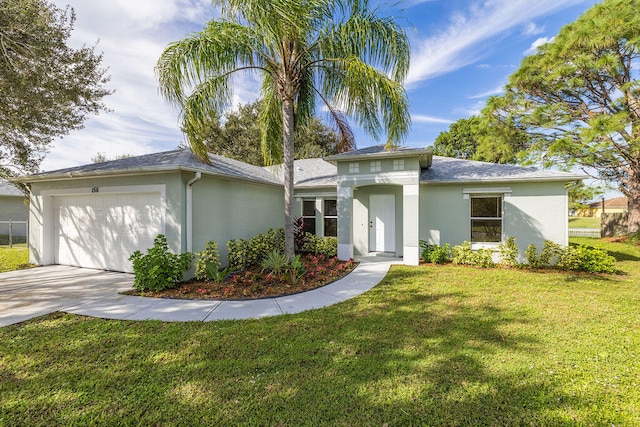 view of front facade featuring a front yard and a garage