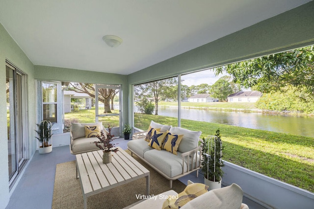 sunroom / solarium with a water view