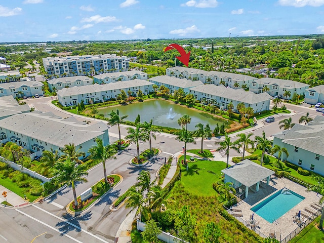 birds eye view of property with a water view