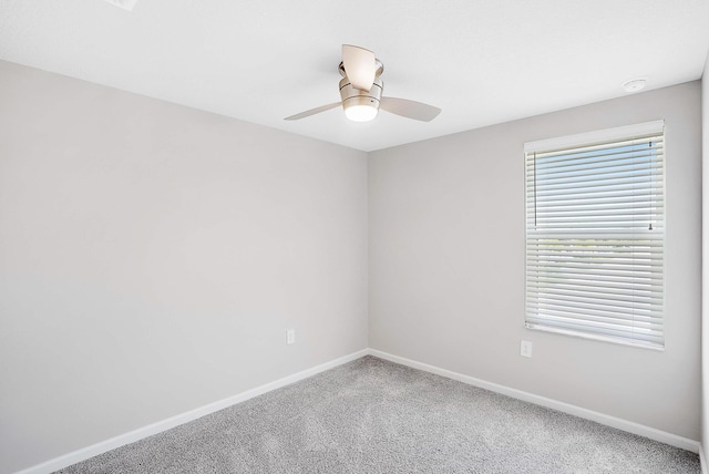 392 SE Sea Hunt Way, Stuart, FL 34994 - carpeted spare room with baseboards and a ceiling fan