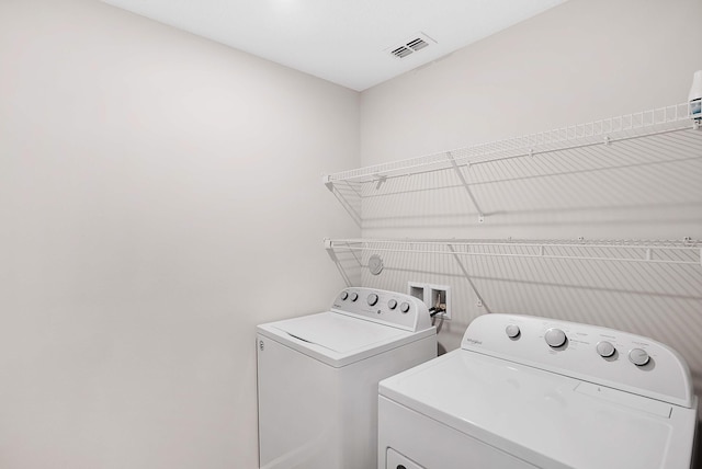392 SE Sea Hunt Way, Stuart, FL 34994 - washroom with independent washer and dryer