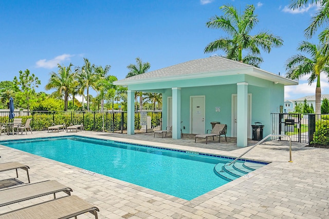 view of swimming pool featuring a gazebo and a patio