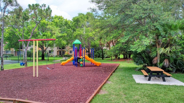 view of playground featuring a lawn