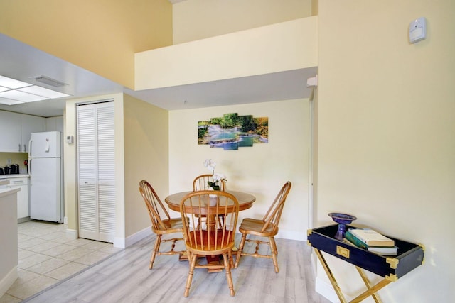 dining area featuring light wood-type flooring