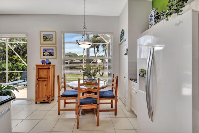 tiled dining area with a healthy amount of sunlight