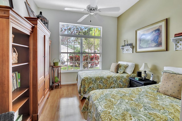 bedroom featuring light wood-type flooring and ceiling fan