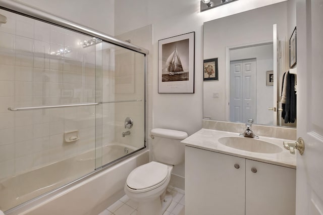 full bathroom with toilet, tile patterned flooring, vanity, and combined bath / shower with glass door