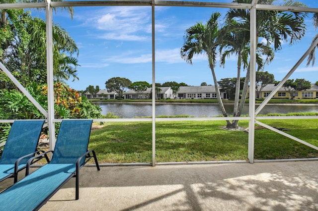 unfurnished sunroom featuring a healthy amount of sunlight and a water view