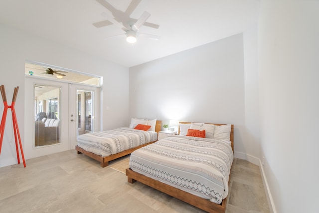 bedroom with ceiling fan and french doors