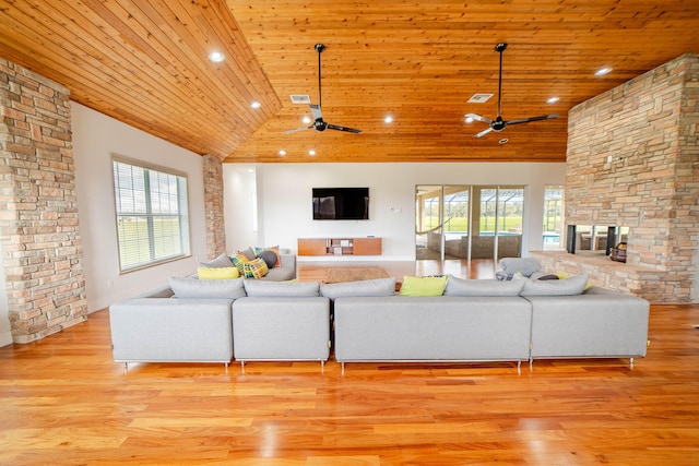 living room with ceiling fan, wood ceiling, and light hardwood / wood-style flooring