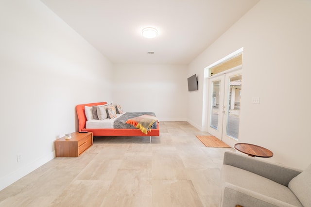 bedroom with access to outside and french doors