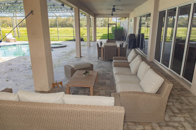 view of patio / terrace featuring an outdoor hangout area, ceiling fan, and a lanai