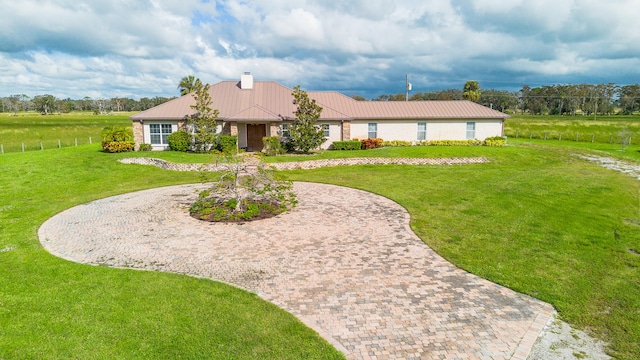 ranch-style house with a front lawn