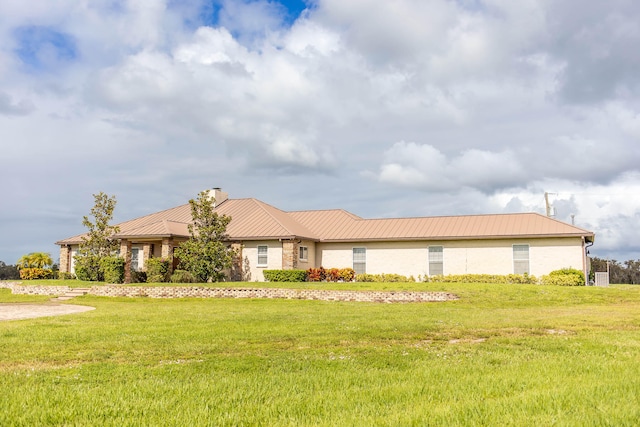 ranch-style house with a front lawn