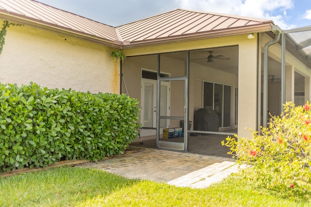 back of house featuring a patio and a sunroom