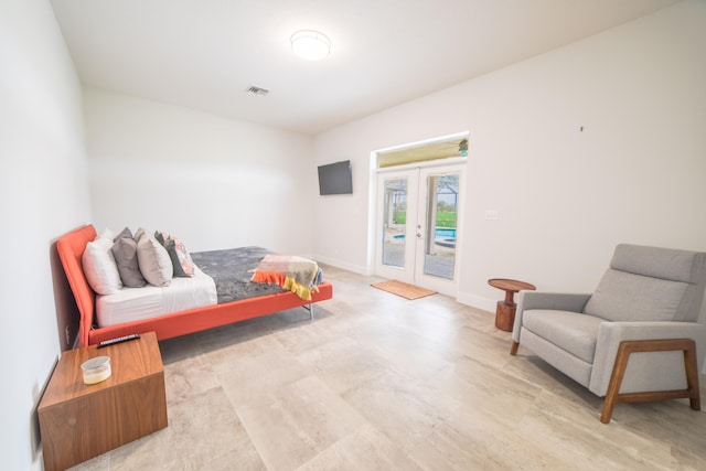 bedroom featuring access to outside and french doors