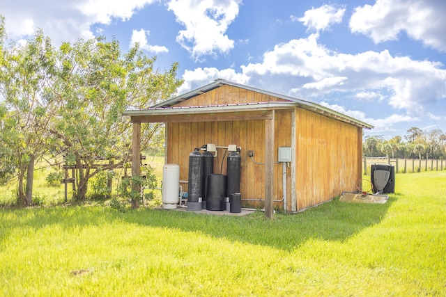 view of outdoor structure with a lawn