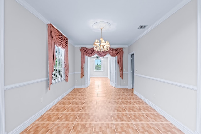 hallway featuring ornamental molding and a chandelier