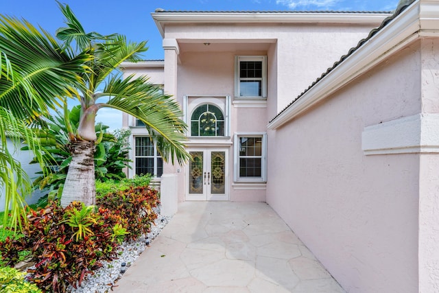 view of exterior entry featuring french doors