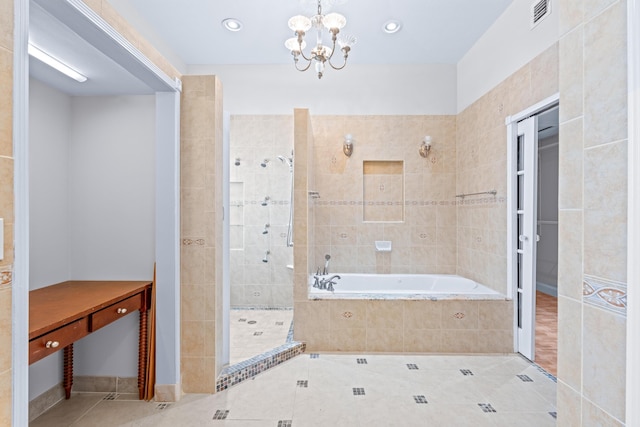 bathroom featuring tile patterned flooring, plus walk in shower, and an inviting chandelier