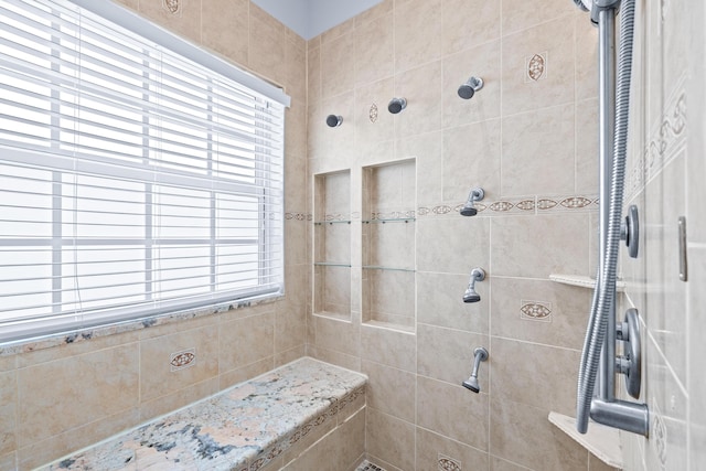 bathroom featuring tiled shower