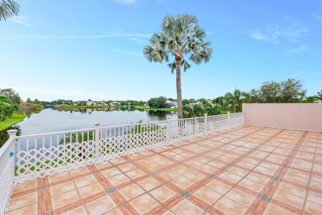 view of patio with a water view