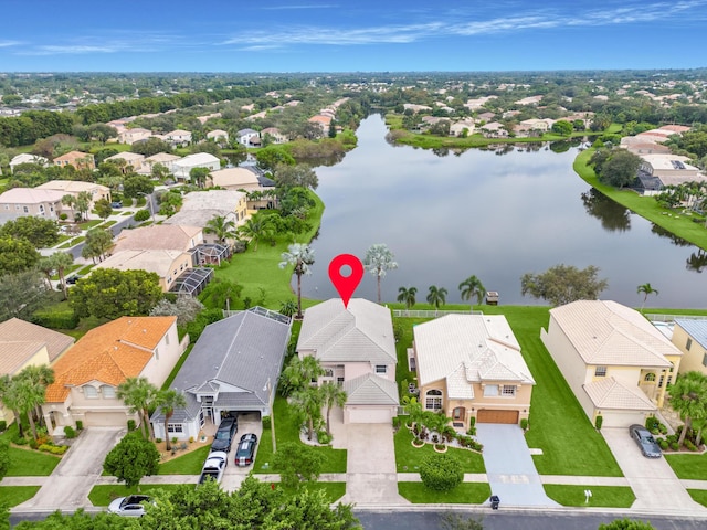 birds eye view of property featuring a water view