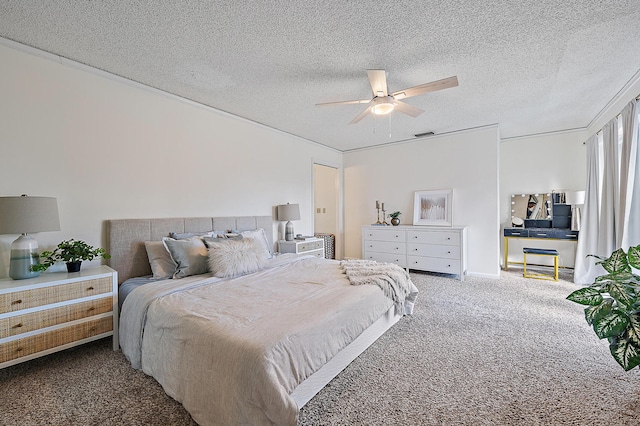 carpeted bedroom featuring a textured ceiling and ceiling fan