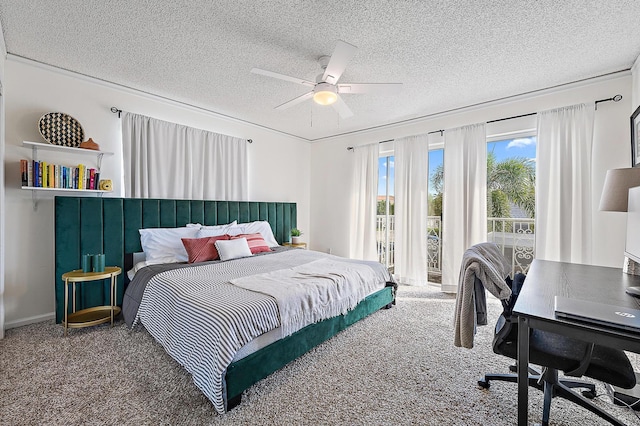 carpeted bedroom with a textured ceiling, an office area, and a ceiling fan