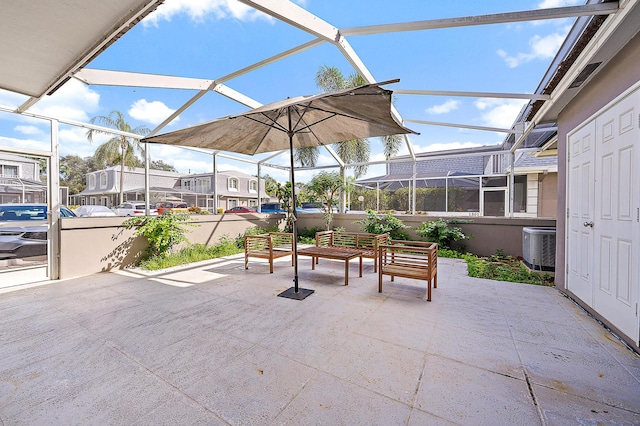 view of patio / terrace featuring glass enclosure and central air condition unit