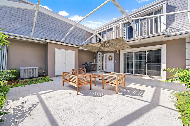 view of patio featuring central air condition unit, a balcony, and an outdoor living space