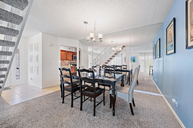 dining area with stairway, a chandelier, light colored carpet, a textured ceiling, and baseboards