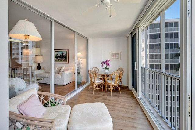 interior space featuring light wood-type flooring and ceiling fan