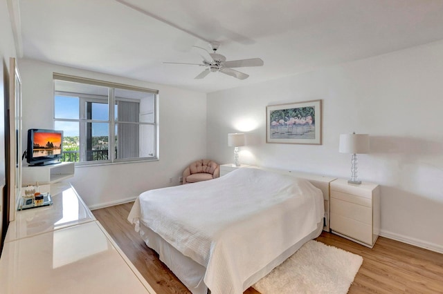 bedroom with ceiling fan and light wood-type flooring