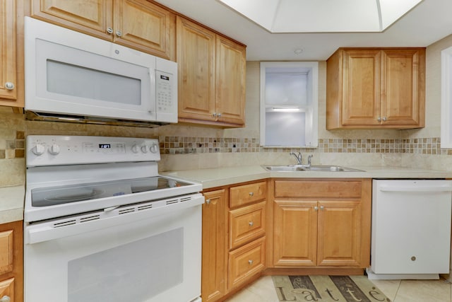 kitchen with white appliances, sink, backsplash, and light tile patterned flooring