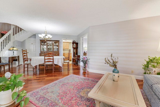 living room featuring a chandelier and hardwood / wood-style floors