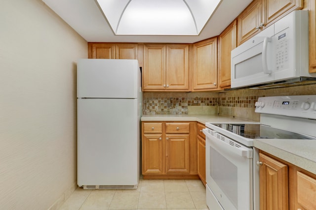 kitchen with backsplash, white appliances, and light tile patterned floors