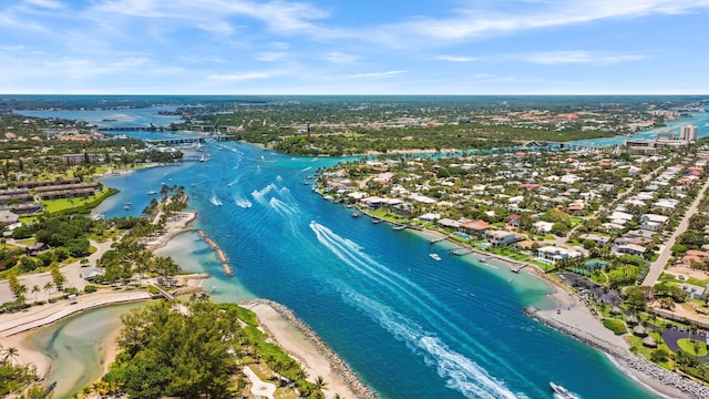 aerial view with a water view and a beach view